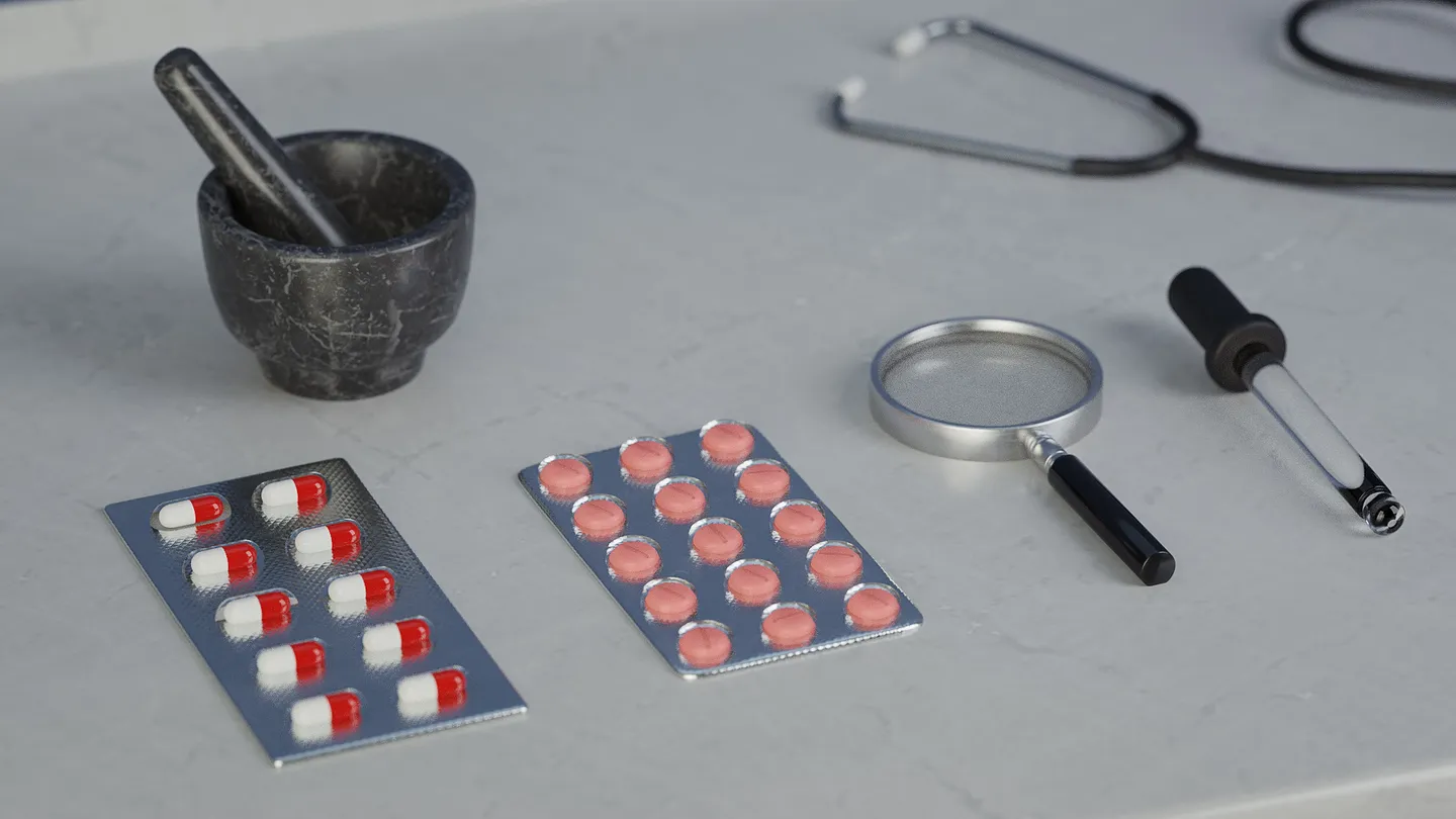 Pill bottle, blister packs, ointment, and medicine containers arranged together.