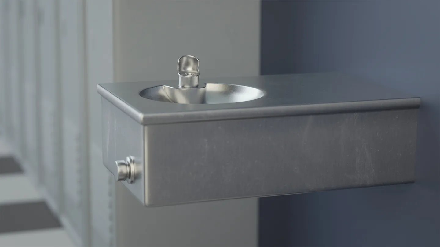 Wall-mounted stylized drinking fountain shown against a blue background.